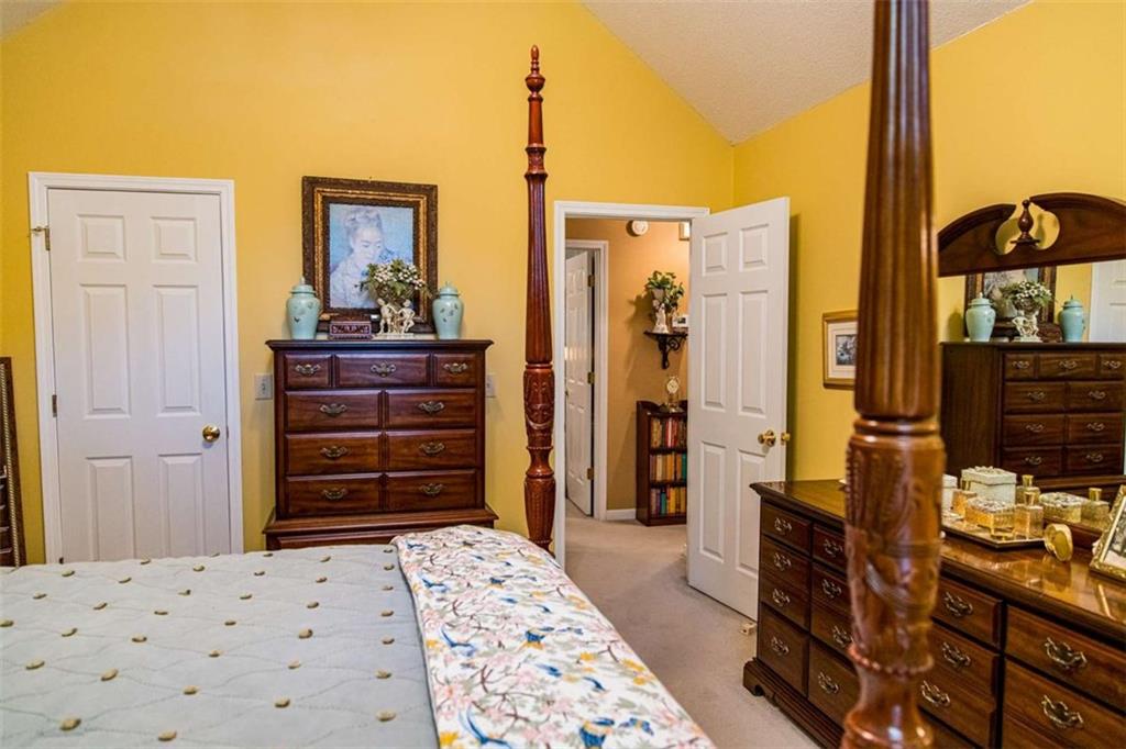 106 Eden Drive Northwest Rome, GA 30165 - Photo 15 of 23 a bedroom with a bed and furniture