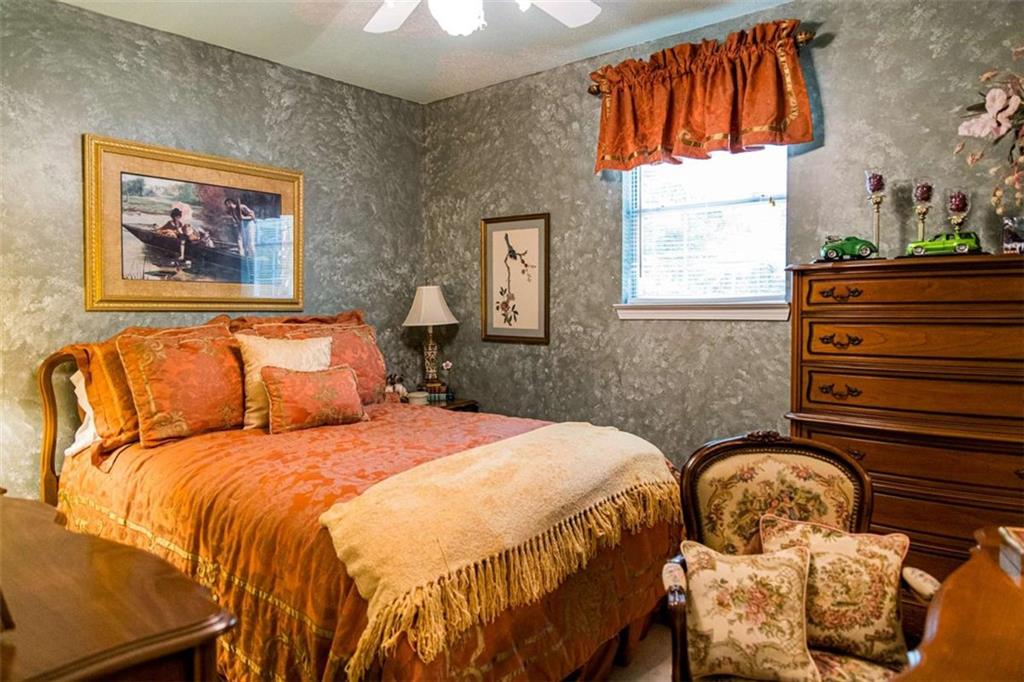 106 Eden Drive Northwest Rome, GA 30165 - Photo 17 of 23 a bedroom with a bed and a window