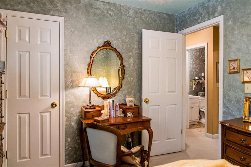 106 Eden Drive Northwest Rome, GA 30165 - Photo 18 of 23 a view of a bathroom with a sink and mirror