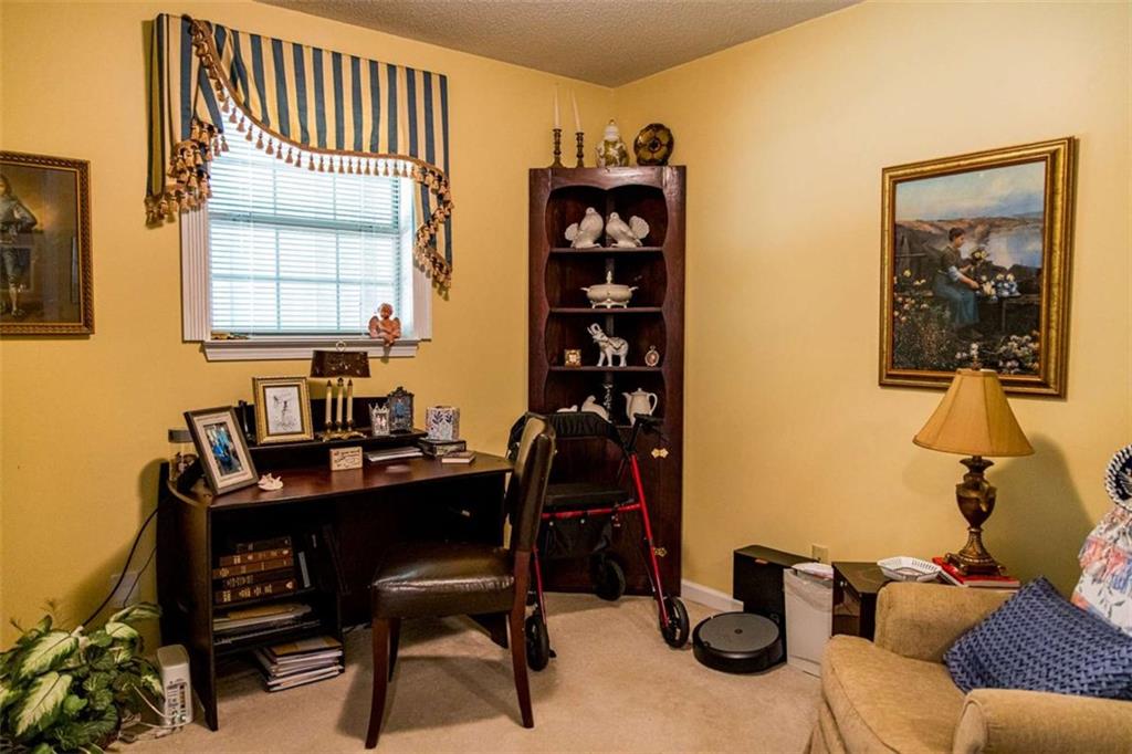 106 Eden Drive Northwest Rome, GA 30165 - Photo 19 of 23 a view of a workspace with furniture and a window