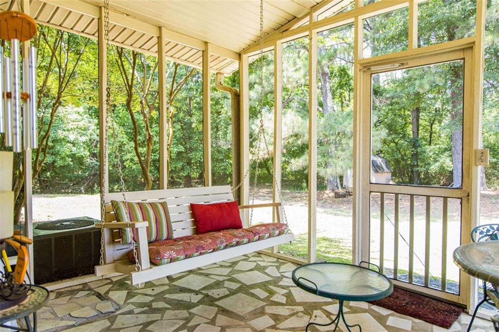 106 Eden Drive Northwest Rome, GA 30165 - Photo 20 of 23 a living room with furniture and a floor to ceiling window