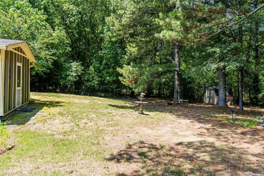 106 Eden Drive Northwest Rome, GA 30165 - Photo 22 of 23 a view of backyard with tree