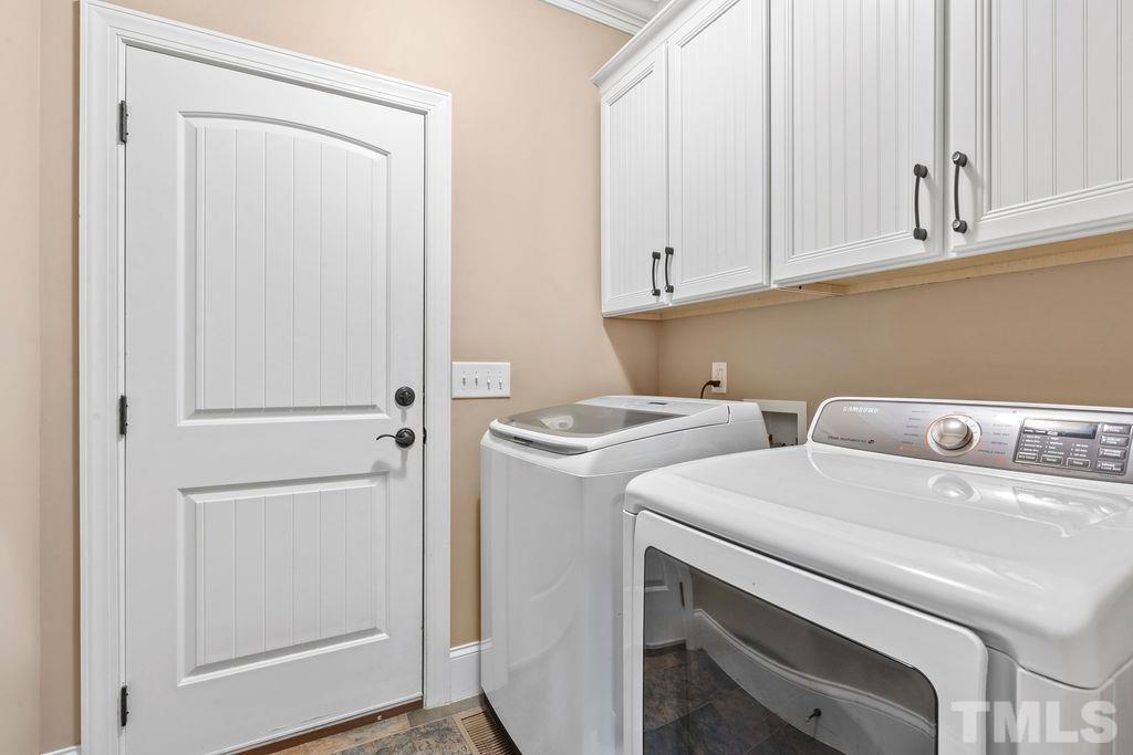 2325 Finley Ridge Lane Raleigh, NC 27615 - Photo 13 of 30 a utility room with dryer and washer