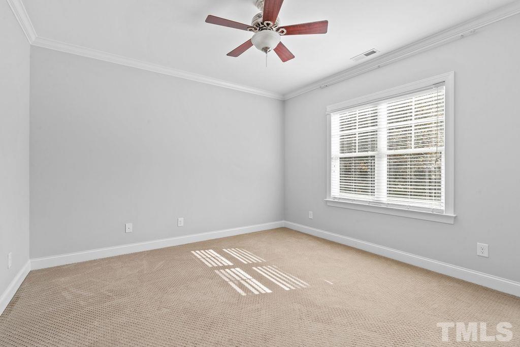 2325 Finley Ridge Lane Raleigh, NC 27615 - Photo 19 of 30 an empty room with a window and a fan