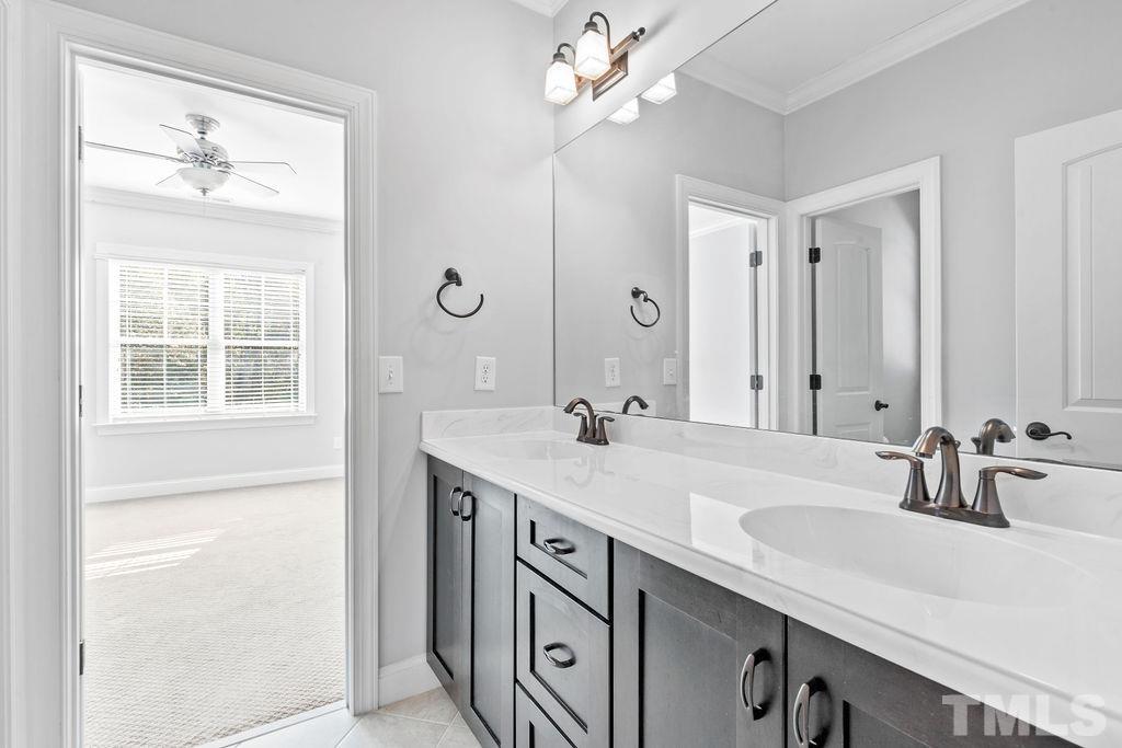 2325 Finley Ridge Lane Raleigh, NC 27615 - Photo 20 of 30 a bathroom with a sink double vanity and a mirror