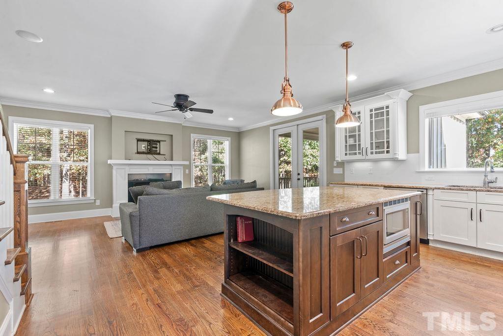 2325 Finley Ridge Lane Raleigh, NC 27615 - Photo 5 of 30 a kitchen with stainless steel appliances granite countertop a stove and a wooden floors