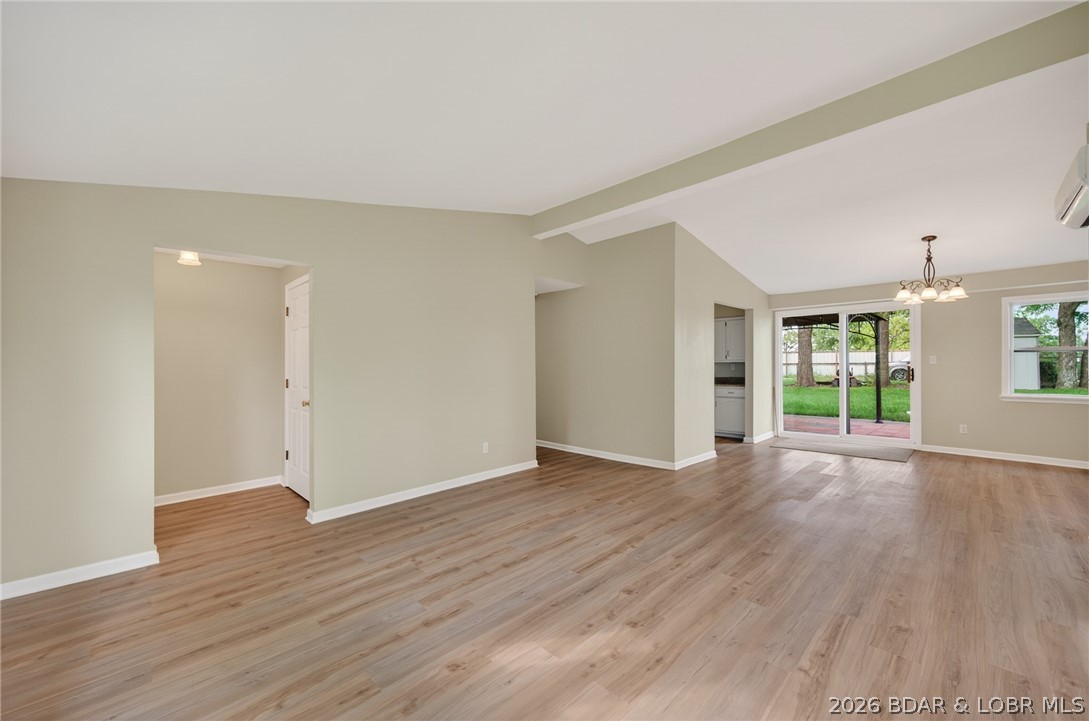 177 Storage Road Eldon, MO 65026 - Photo 7 of 34 The dramatic sloped ceiling enhances the sense of