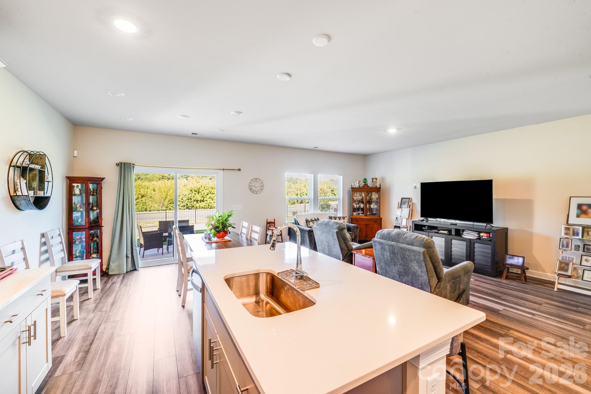 1340 Sweet Pea Street Monroe, NC 28110 - Photo 15 of 32 a living room with furniture and a flat screen tv