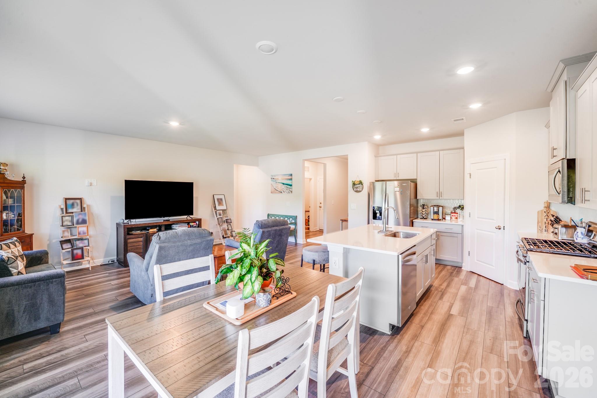 1340 Sweet Pea Street Monroe, NC 28110 - Photo 18 of 32 a living room with fireplace furniture and a flat screen tv