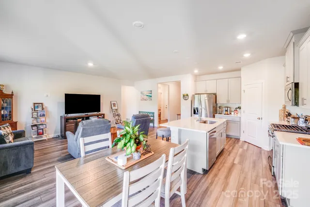 a living room with fireplace furniture and a flat screen tv