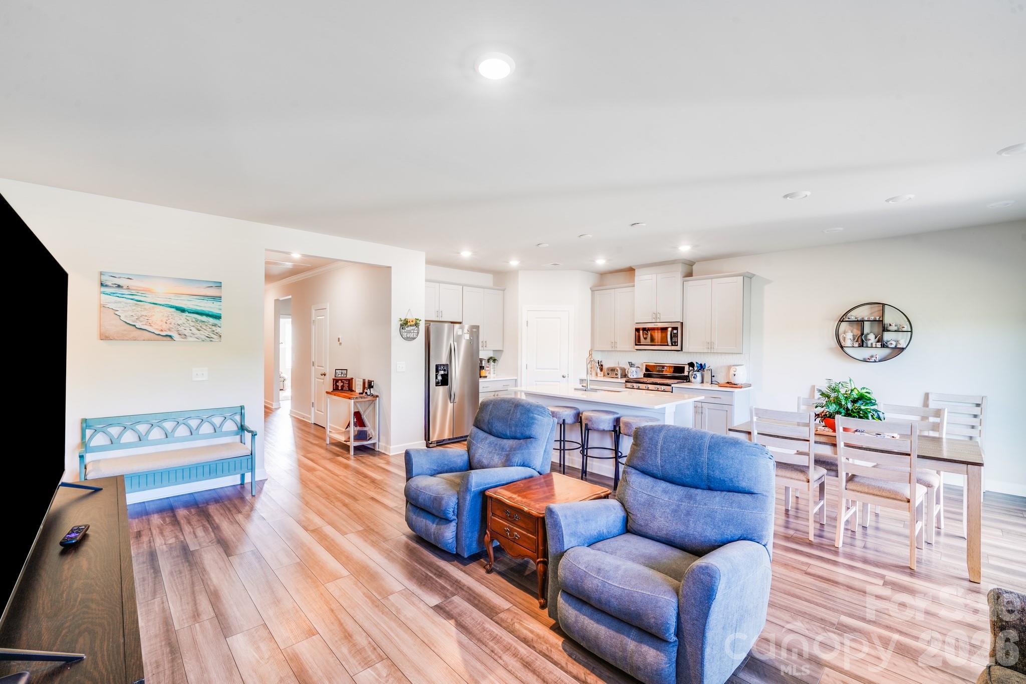 1340 Sweet Pea Street Monroe, NC 28110 - Photo 19 of 32 a living room with furniture and a wooden floor