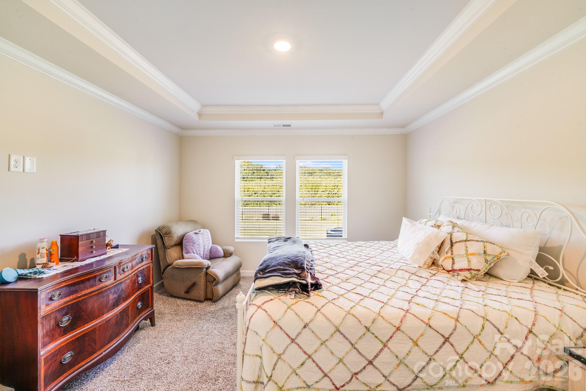 1340 Sweet Pea Street Monroe, NC 28110 - Photo 21 of 32 a bedroom with a bed and a window