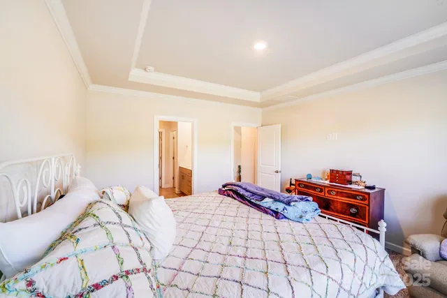 a bedroom with a bed and a lamp