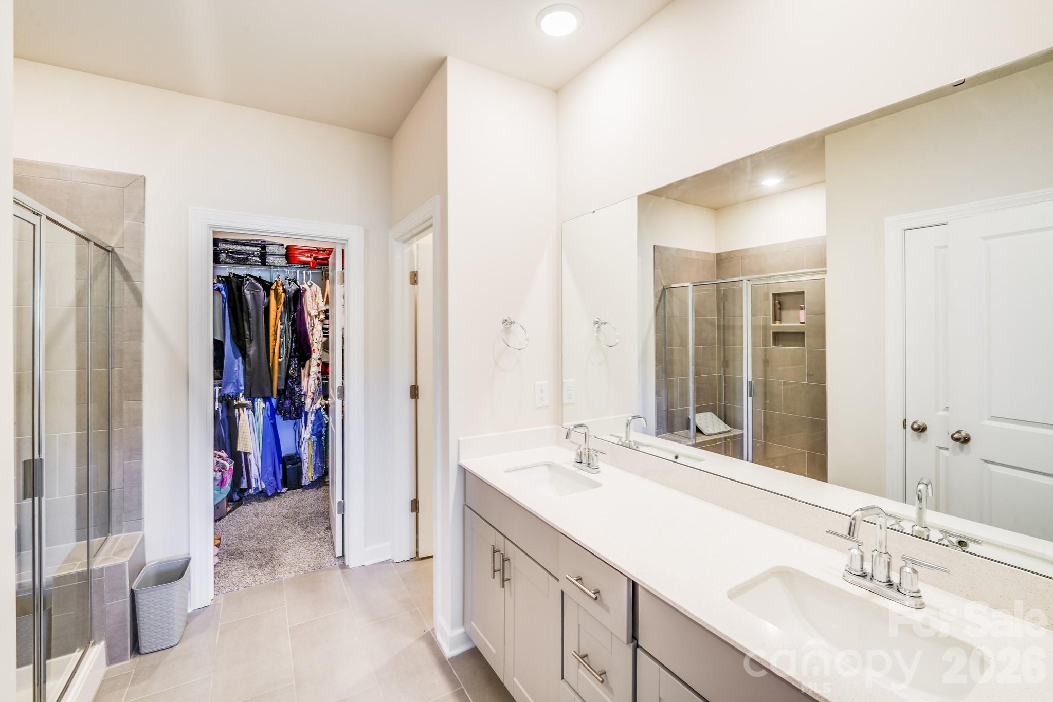 1340 Sweet Pea Street Monroe, NC 28110 - Photo 23 of 32 a bathroom with a double vanity sink and a mirror