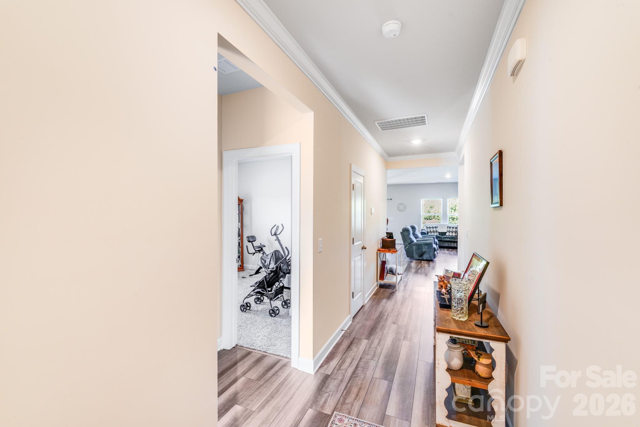 1340 Sweet Pea Street Monroe, NC 28110 - Photo 28 of 32 a view of a hallway with furniture and wooden floor