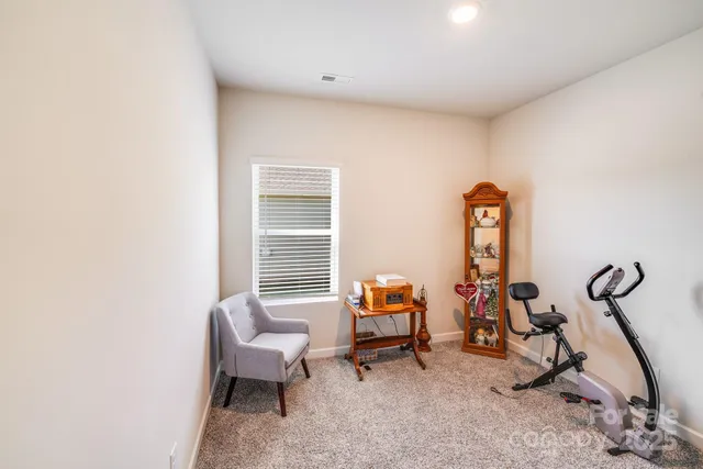a view of a house with a yard porch and sitting area