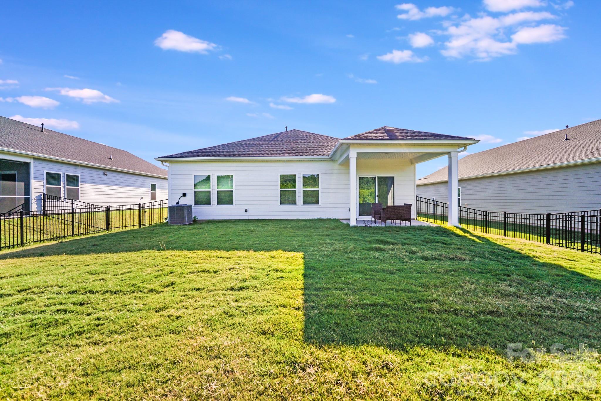 1340 Sweet Pea Street Monroe, NC 28110 - Photo 30 of 32 a view of a house with a yard porch and sitting area