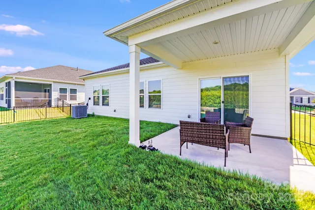 a view of a swimming pool and a yard
