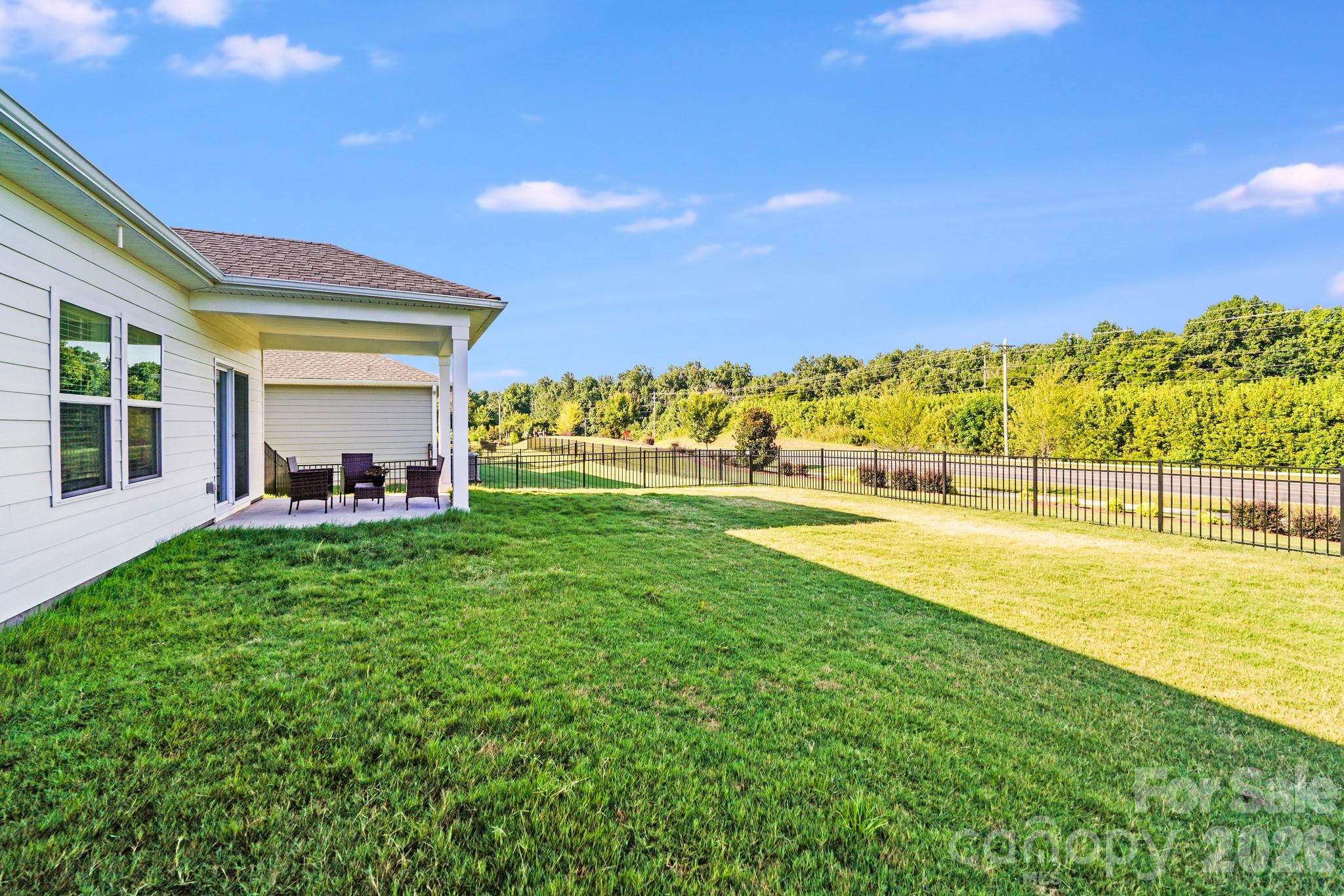 1340 Sweet Pea Street Monroe, NC 28110 - Photo 32 of 32 a view of a swimming pool and a yard