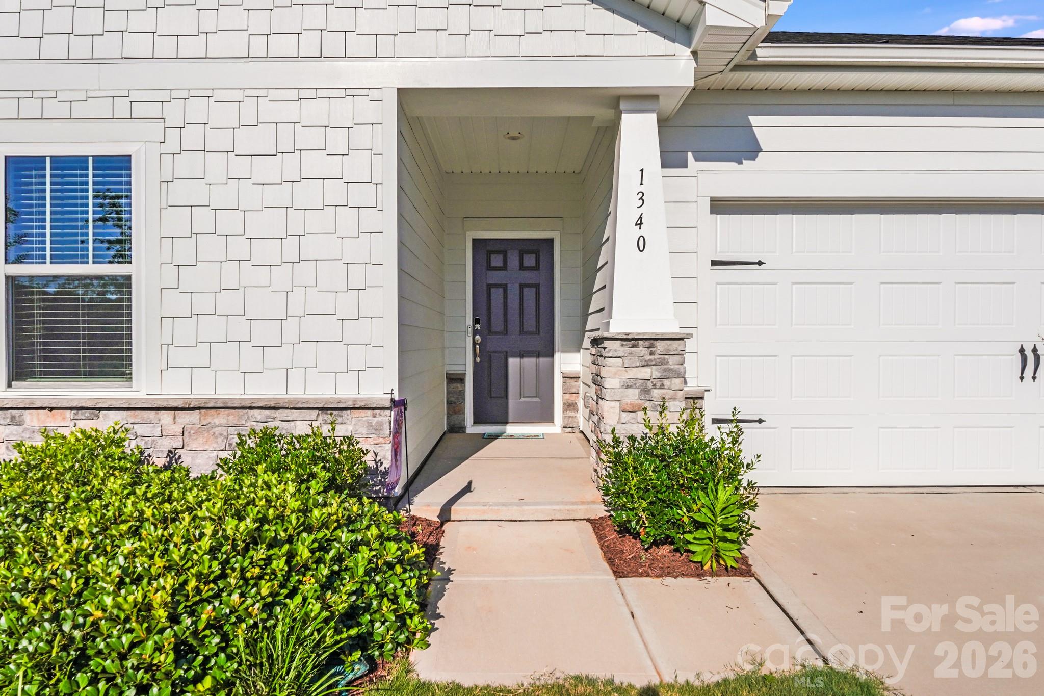 1340 Sweet Pea Street Monroe, NC 28110 - Photo 4 of 32 a entryway with flower pots