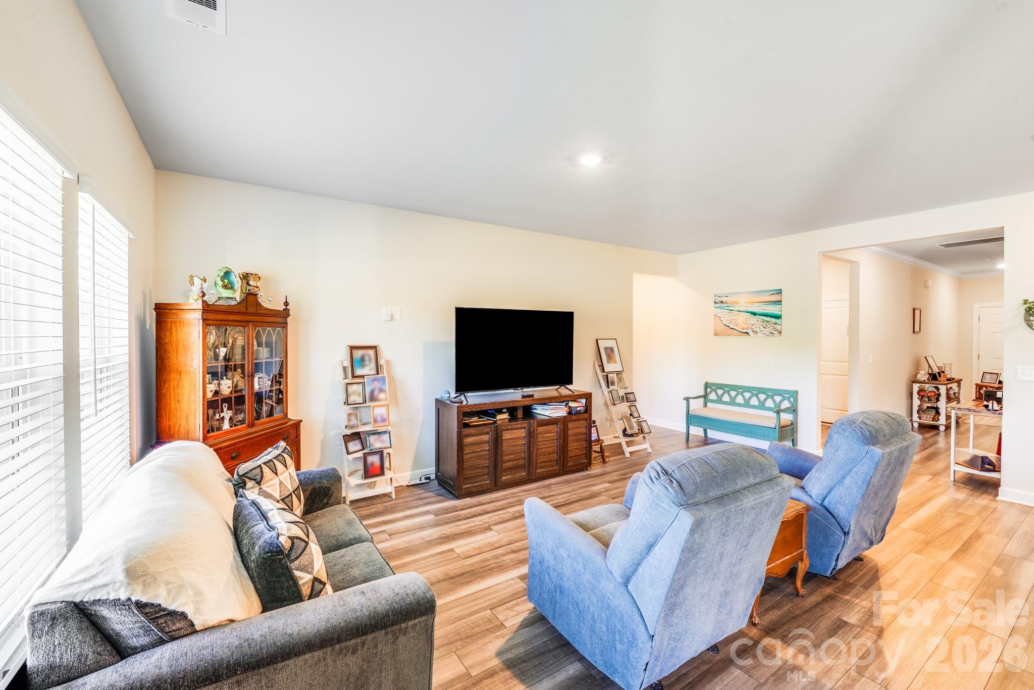 1340 Sweet Pea Street Monroe, NC 28110 - Photo 10 of 32 a living room with furniture and a flat screen tv