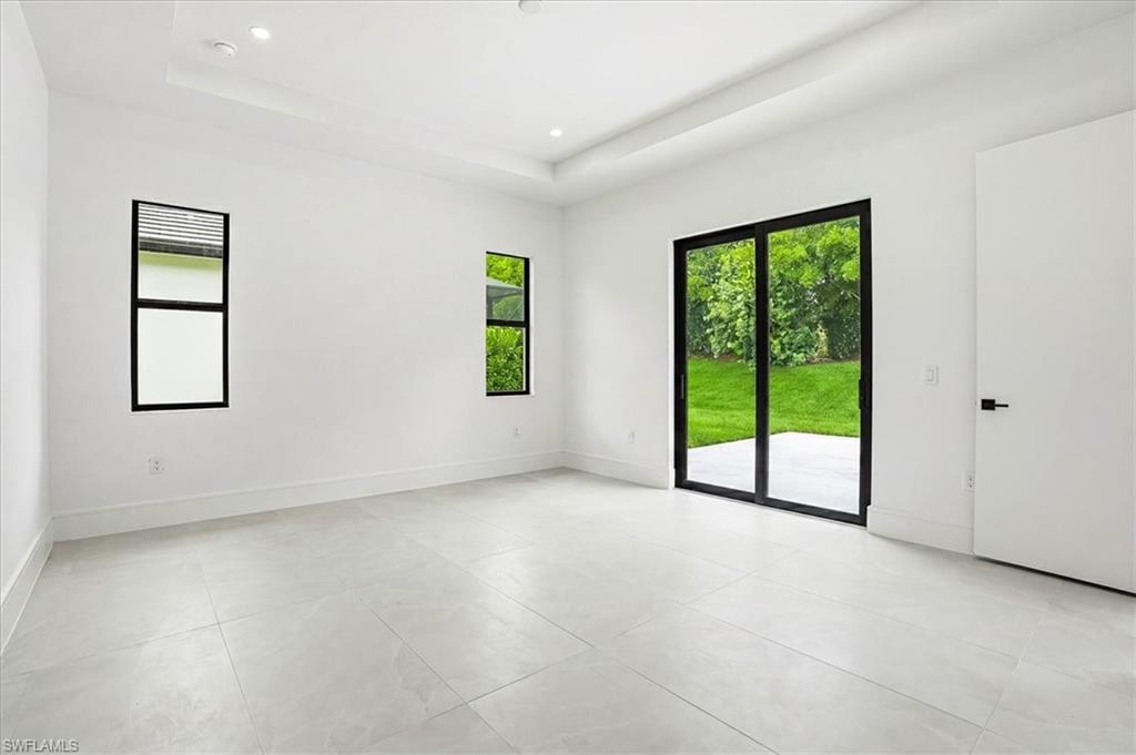 14318 Charthouse Circle Naples, FL 34114 - Photo 15 of 36 a view of an empty room with a window