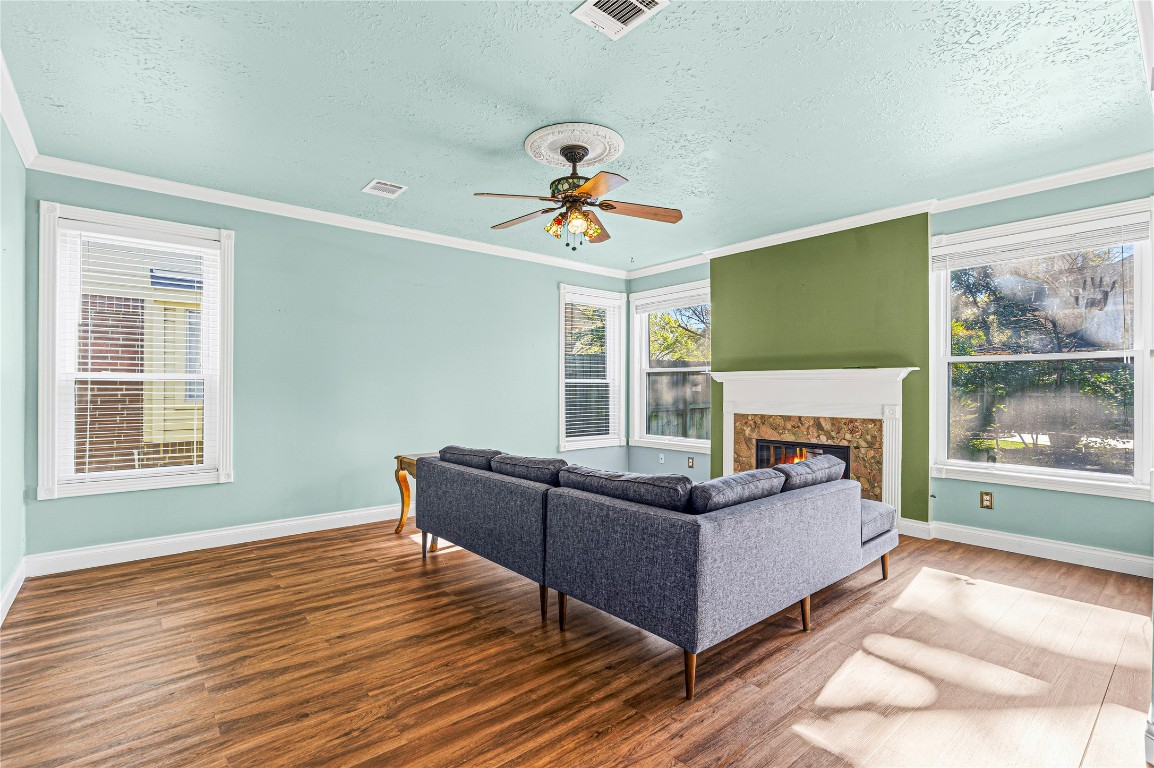 7906 Duncansby Vale Road Houston, TX 77095 - Photo 14 of 48 Large windows fill the space with natural light, creating a bright and inviting living room.