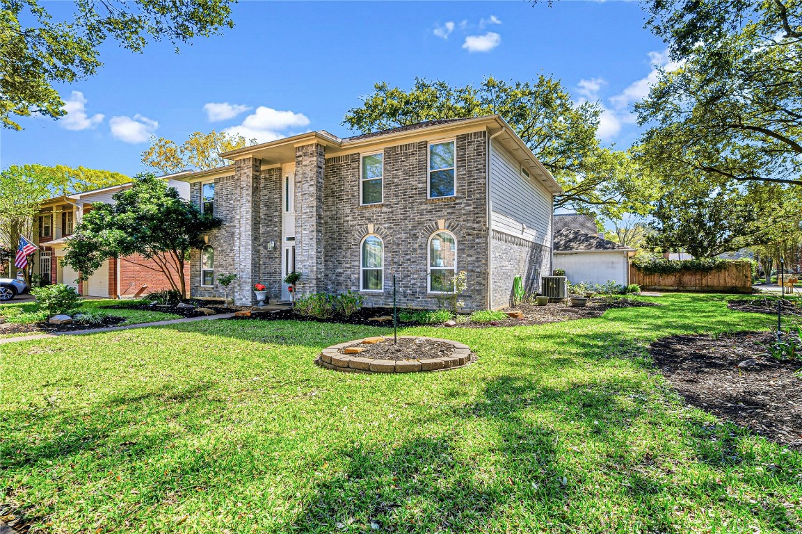 7906 Duncansby Vale Road Houston, TX 77095 - Photo 2 of 48 Situated on a generously sized corner lot, this property offers more outdoor space than most homes in Wheatstone Village.