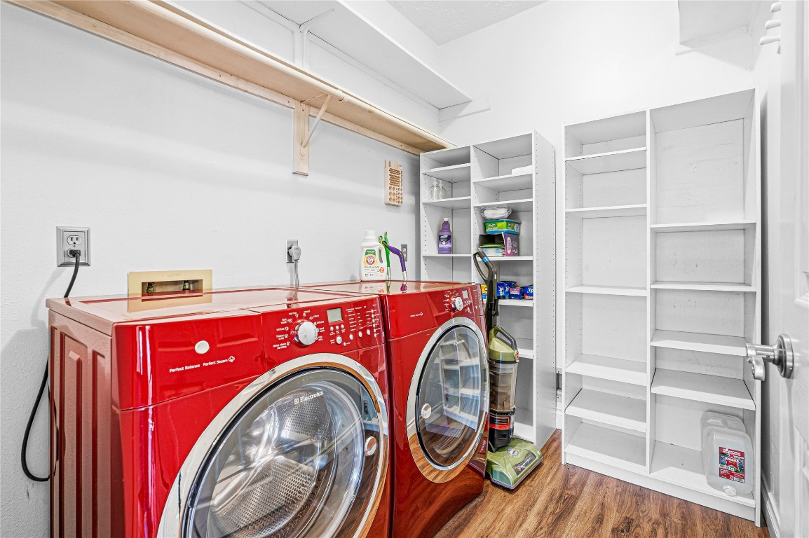 7906 Duncansby Vale Road Houston, TX 77095 - Photo 22 of 48 Dedicated laundry room with storage keeps daily routines organized and efficient.