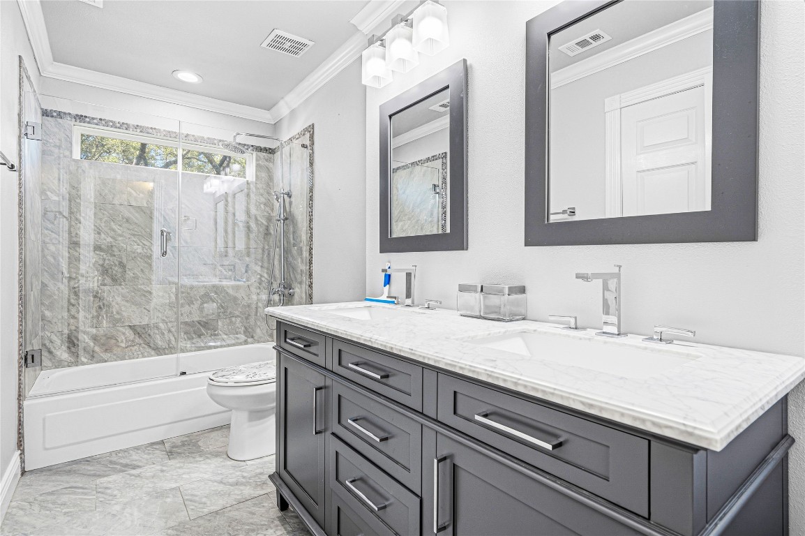 7906 Duncansby Vale Road Houston, TX 77095 - Photo 37 of 48 Updated second bathroom with dual sinks, modern finishes, and a glass-enclosed shower.