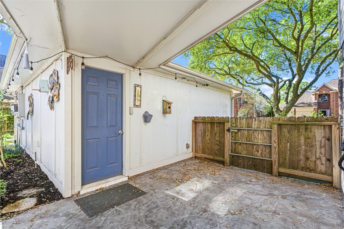 7906 Duncansby Vale Road Houston, TX 77095 - Photo 39 of 48 Covered walkway leading to the garage can also be used as a covered space in the backyard ideal for relaxing or enjoying quiet evenings overlooking the fabulous backyard landscape.