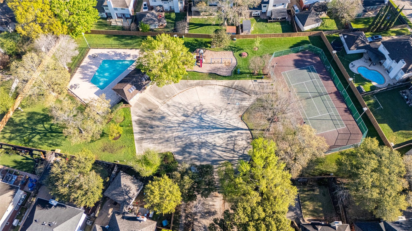 7906 Duncansby Vale Road Houston, TX 77095 - Photo 47 of 48 Community amenities—including pool, tennis courts, and playground—located just behind the home.