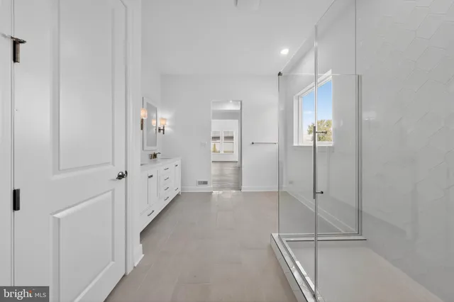 a view of a hallway with white walls