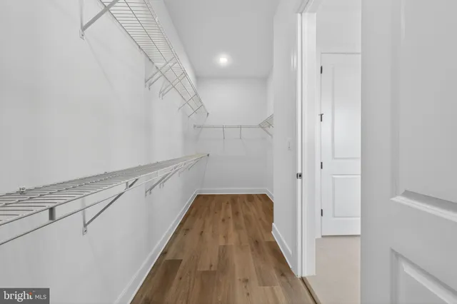 a bathroom with a bathtub and a window