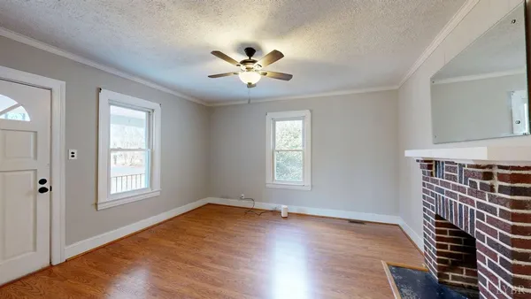 wooden floor in an empty room with a window