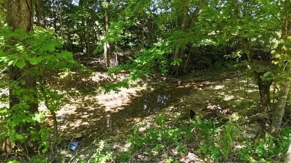 a view of a lake with sitting area