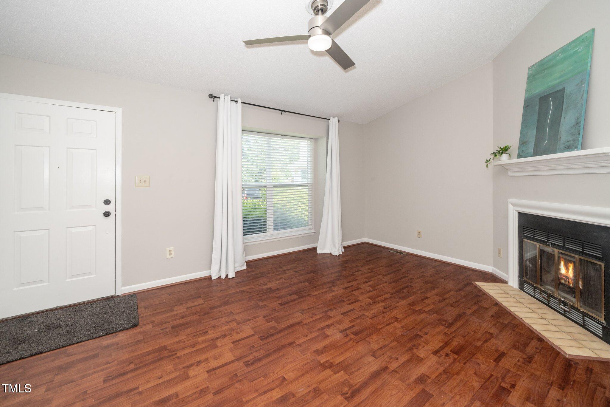 6016 Farm Gate Road Raleigh, NC 27606 - Photo 4 of 23 6016 living room 2