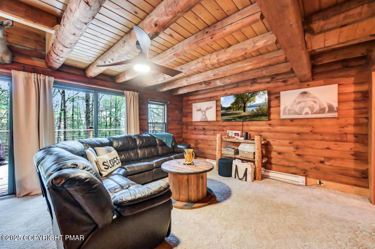 185 Whispering Pine Road Kunkletown, PA 18058 - Photo 11 of 65 a living room with furniture and a large window