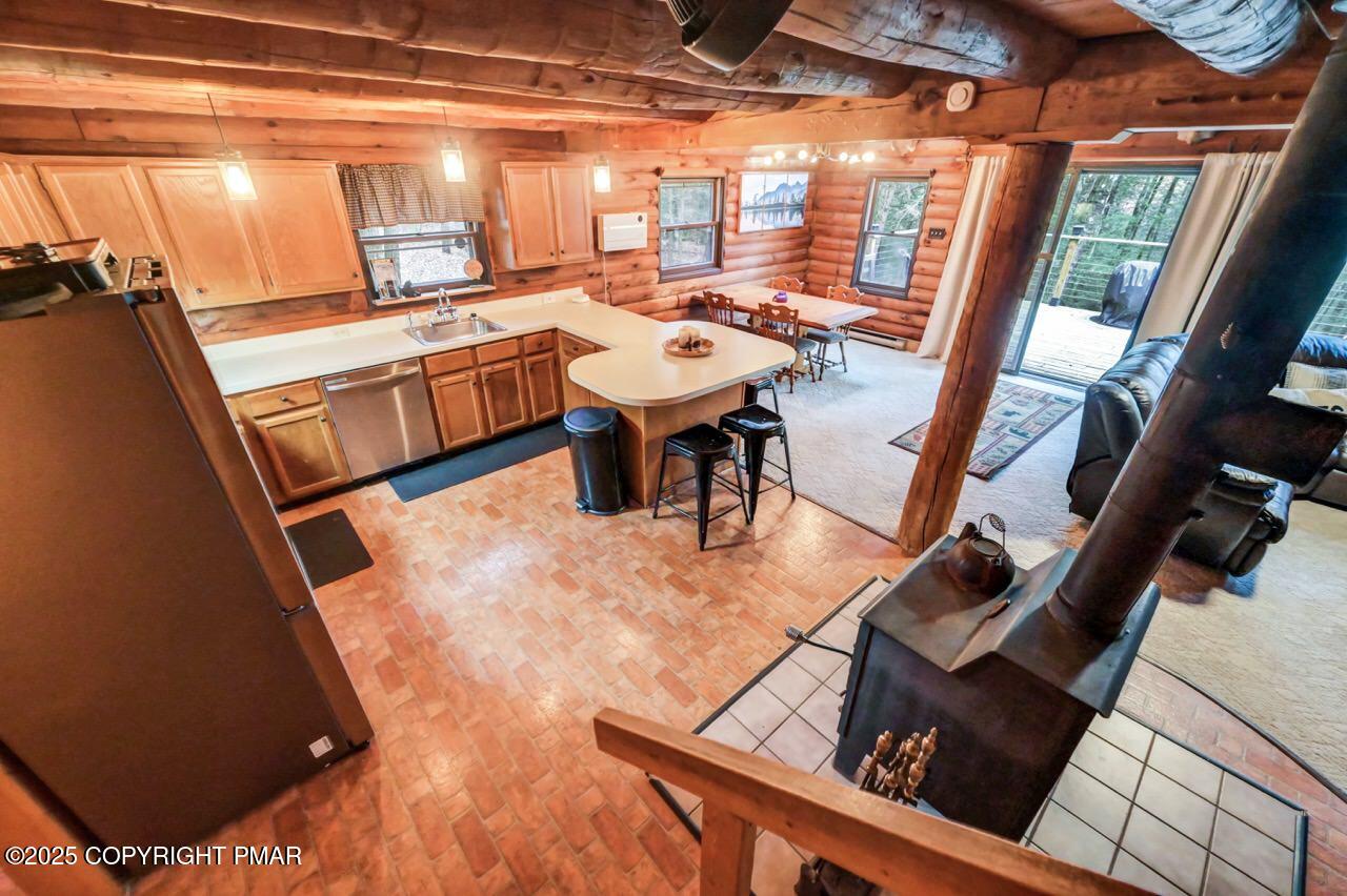 185 Whispering Pine Road Kunkletown, PA 18058 - Photo 27 of 65 a dining room with furniture and a floor to ceiling window