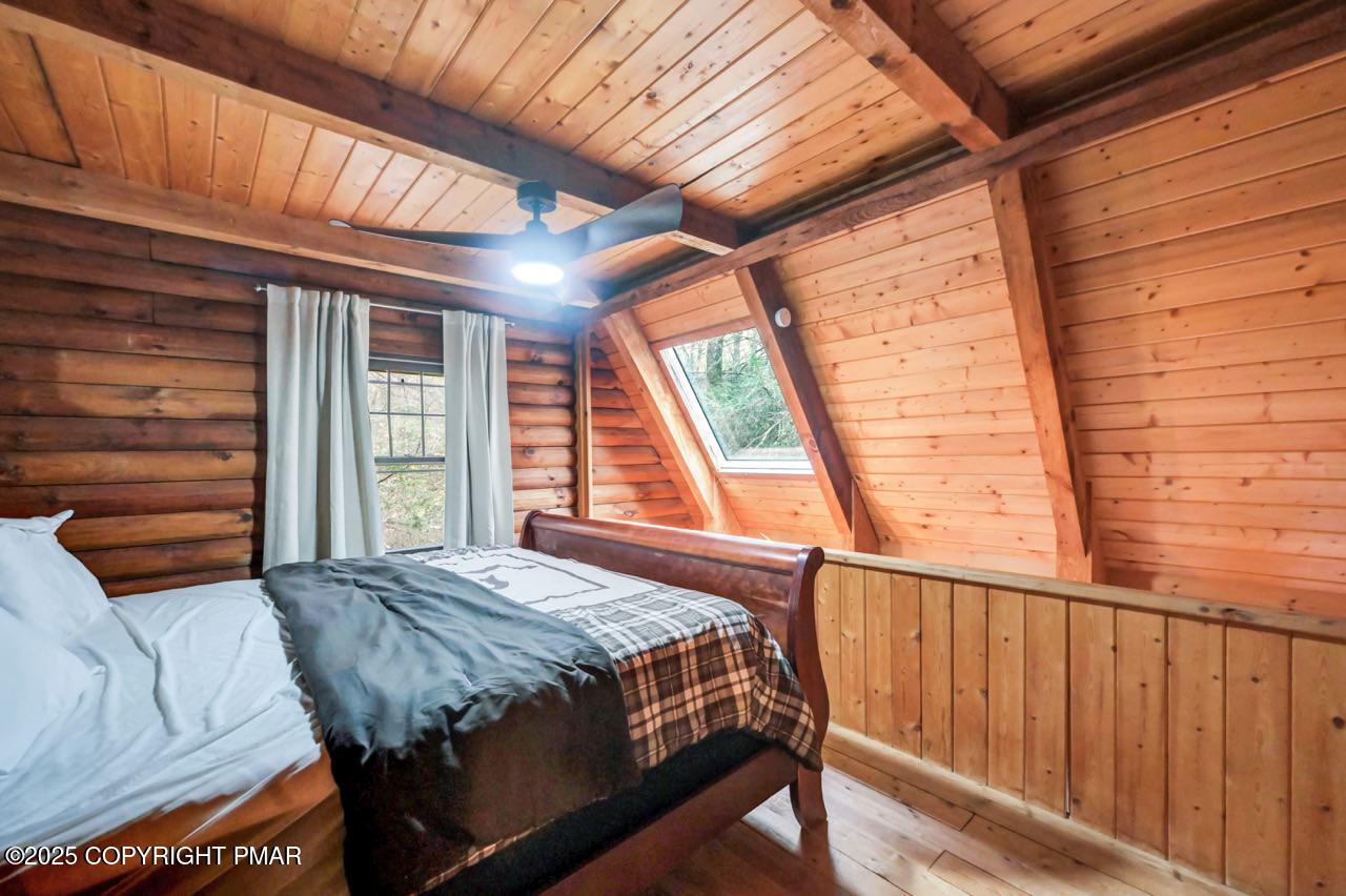 185 Whispering Pine Road Kunkletown, PA 18058 - Photo 28 of 65 a bedroom with a bed and a window