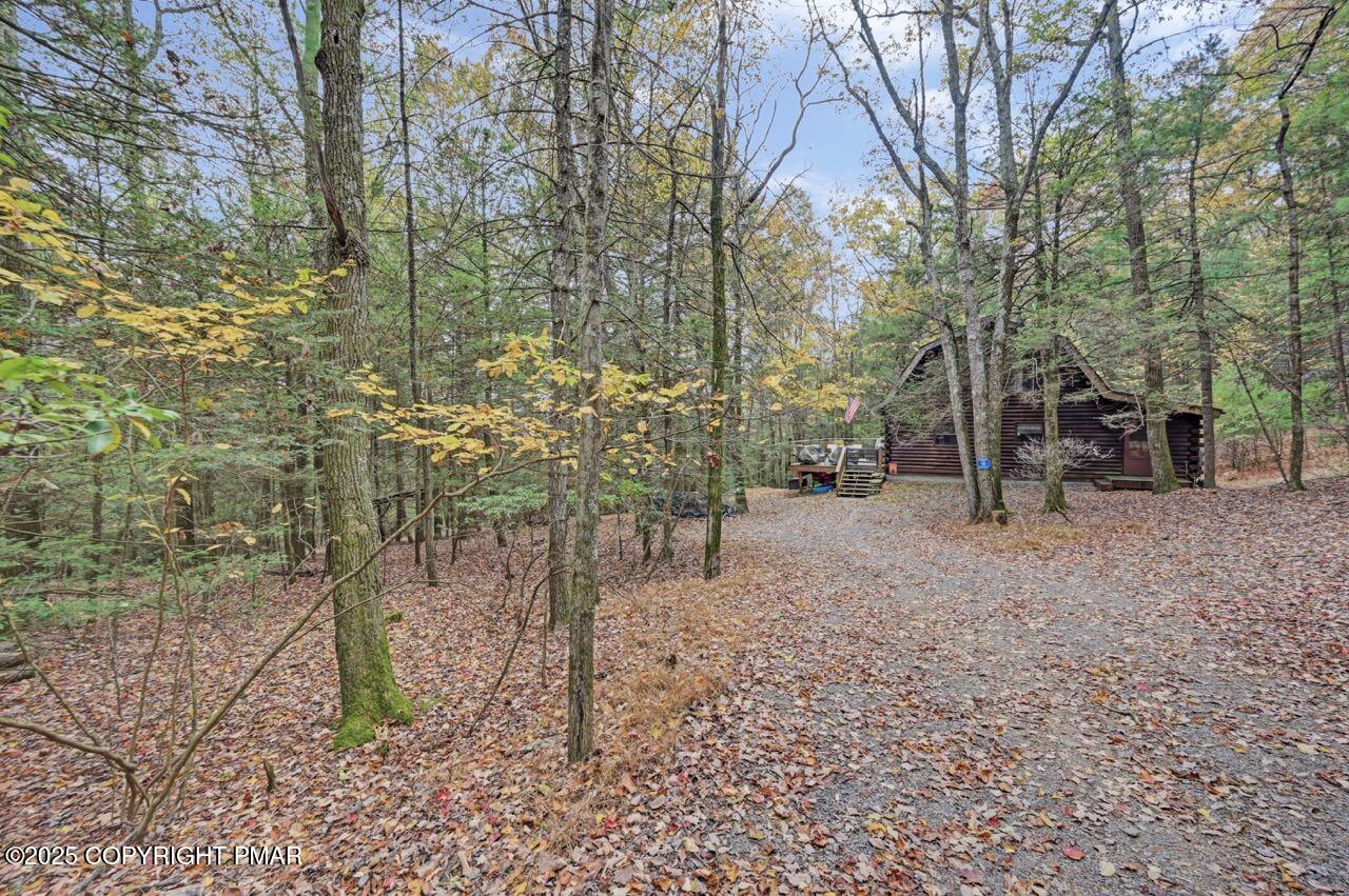 185 Whispering Pine Road Kunkletown, PA 18058 - Photo 3 of 65 a backyard of a house with lots of green space