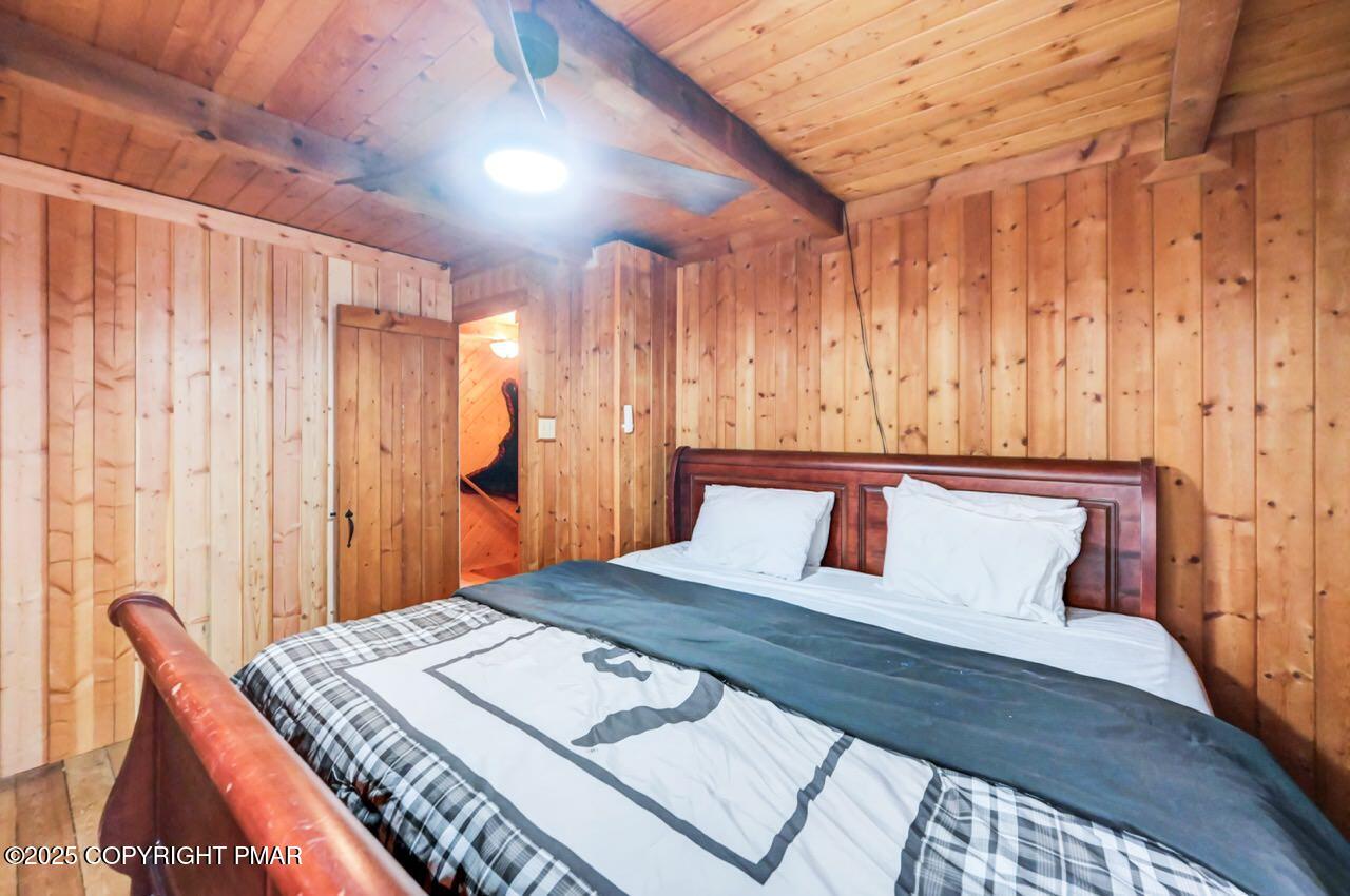 185 Whispering Pine Road Kunkletown, PA 18058 - Photo 31 of 65 a bedroom with a bed and a dresser