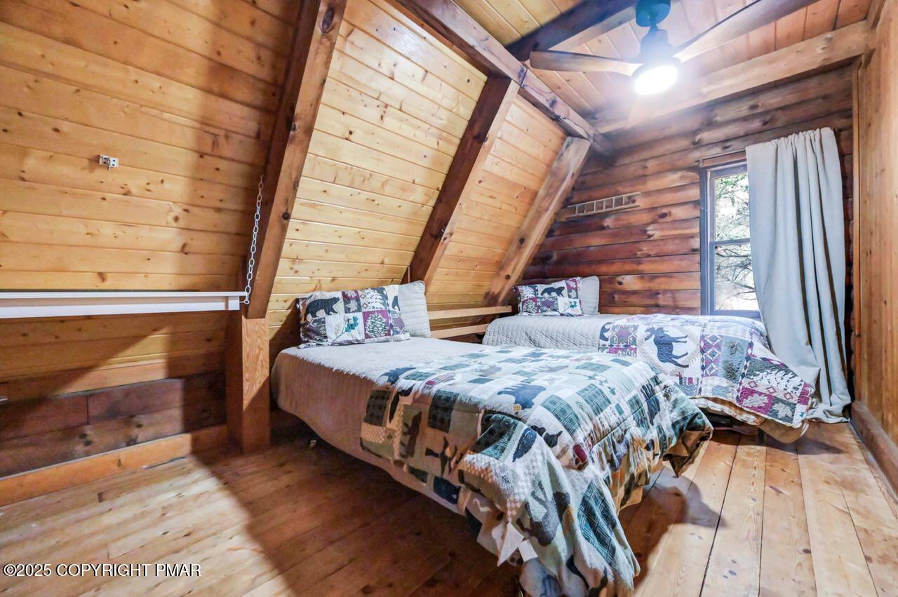 185 Whispering Pine Road Kunkletown, PA 18058 - Photo 33 of 65 a bed sitting in a bedroom next to a window