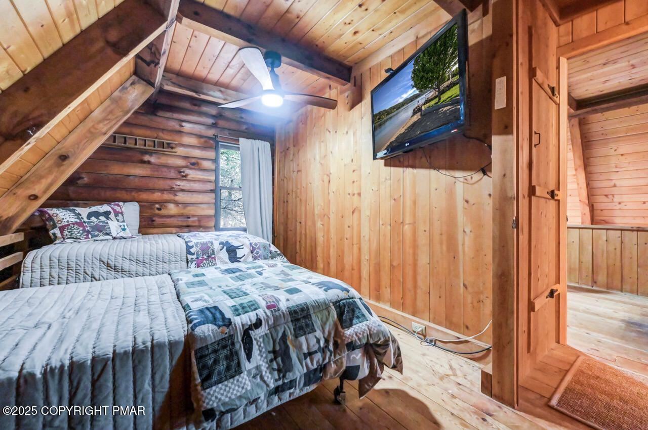 185 Whispering Pine Road Kunkletown, PA 18058 - Photo 34 of 65 a bed sitting in a bedroom next to a window