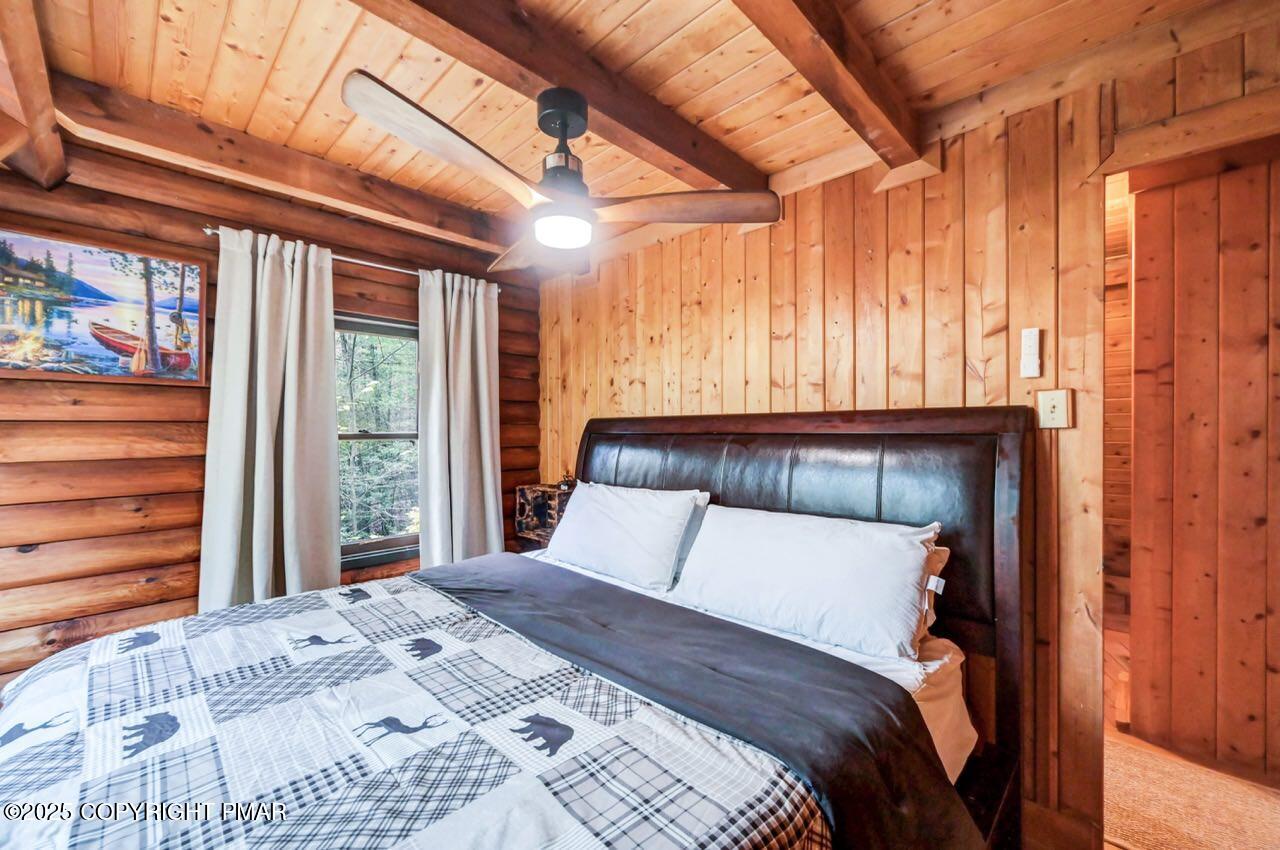 185 Whispering Pine Road Kunkletown, PA 18058 - Photo 38 of 65 a bedroom with a large bed and a large window