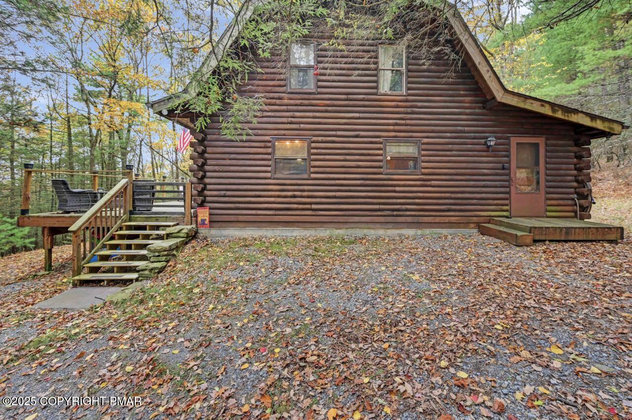 185 Whispering Pine Road Kunkletown, PA 18058 - Photo 4 of 65 a view of a house with a yard and wooden fence