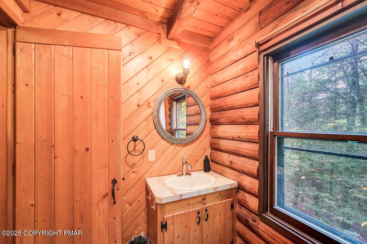 185 Whispering Pine Road Kunkletown, PA 18058 - Photo 41 of 65 a view of a door with a sink and a backyard