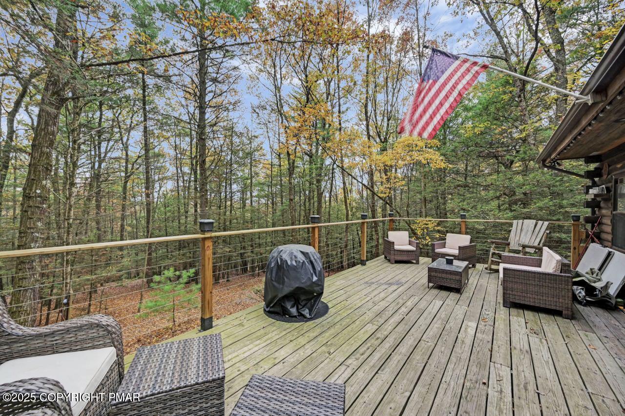 185 Whispering Pine Road Kunkletown, PA 18058 - Photo 53 of 65 a view of a roof deck with wooden floor and outdoor seating