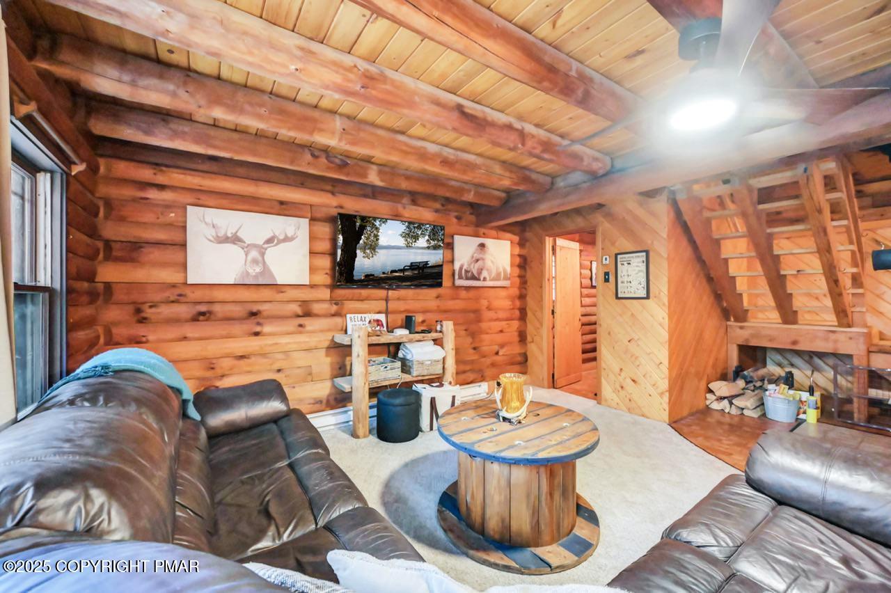 185 Whispering Pine Road Kunkletown, PA 18058 - Photo 59 of 65 a living room with patio furniture and a fireplace