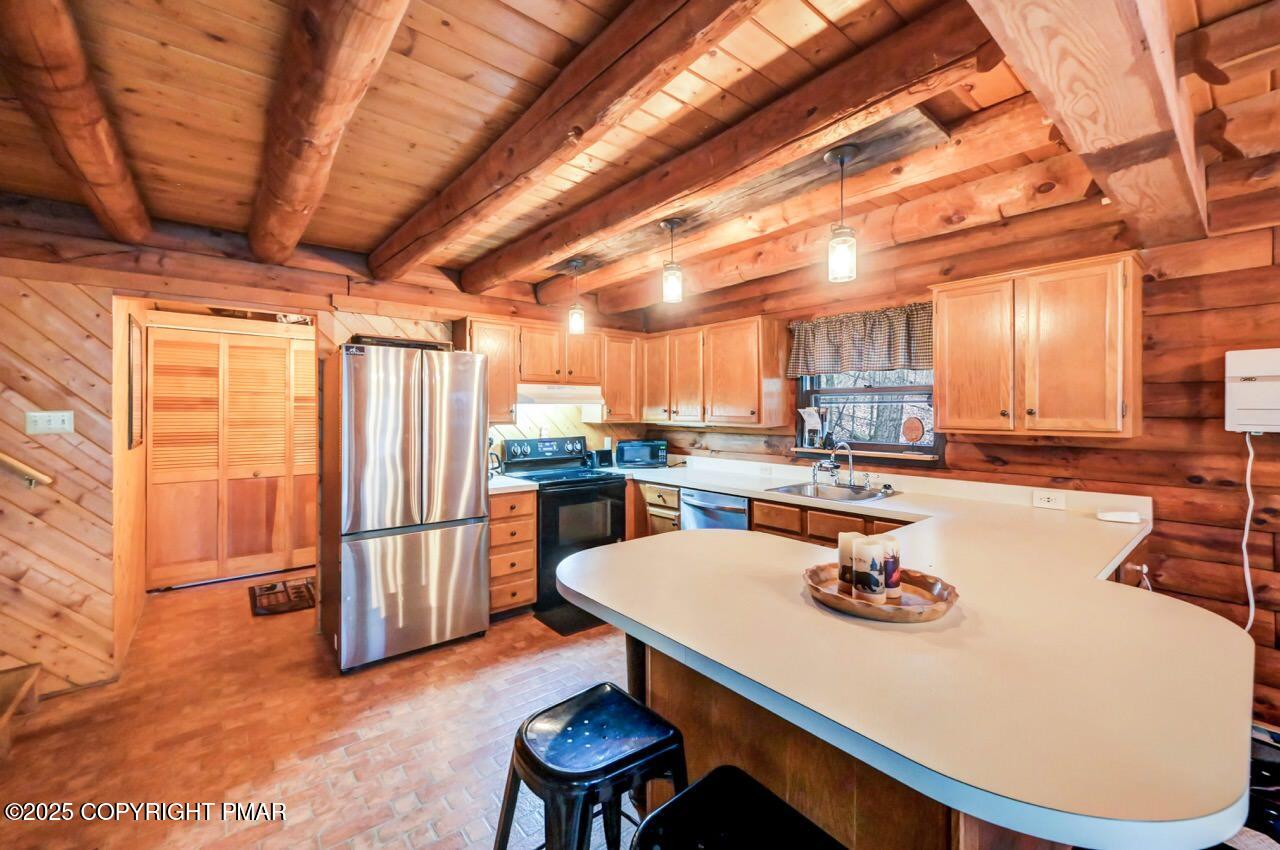 185 Whispering Pine Road Kunkletown, PA 18058 - Photo 60 of 65 a view of a dining room with furniture window and wooden floor